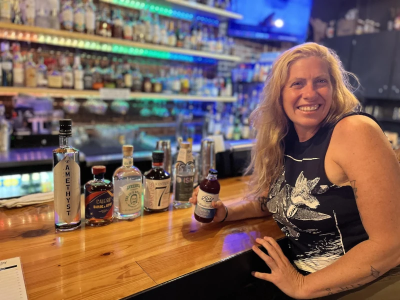 Posing at the bar with a drink in Speakeasy in Carrboro