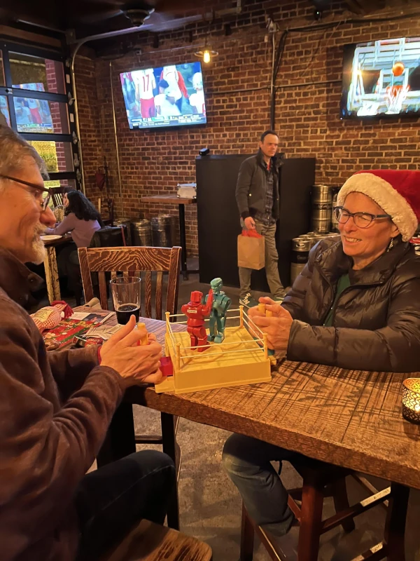 Two people playing games and having fun at Speakeasy
